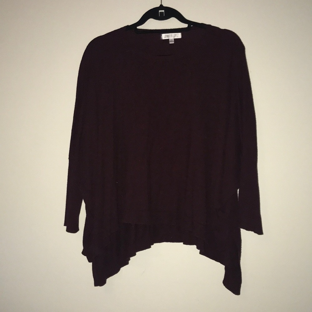 Maroon tunic with fake buttons on the sleeve